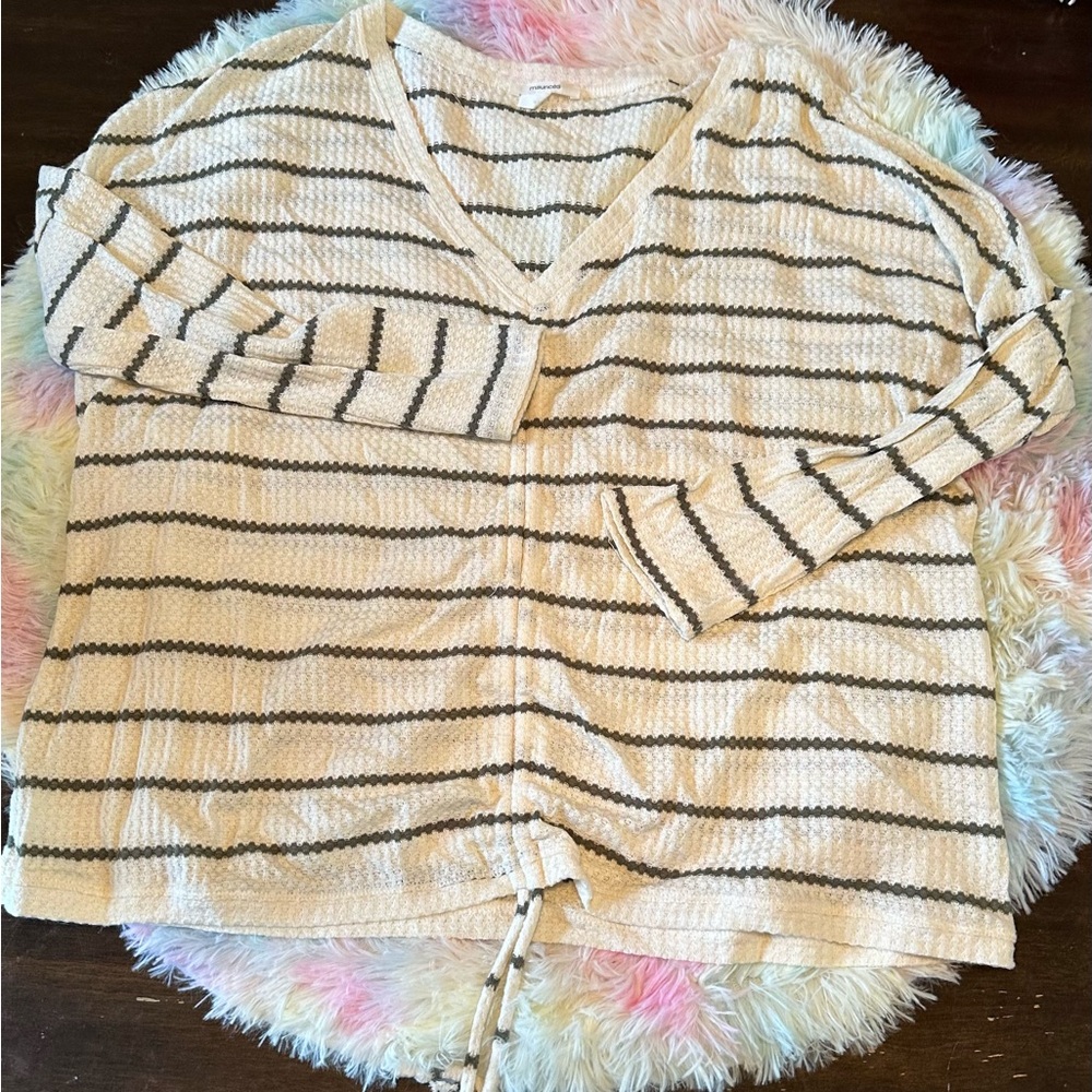 L Maurice’s cropped light sweater